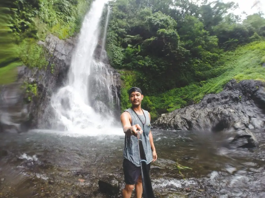 Travel influencer taking photo selfie
