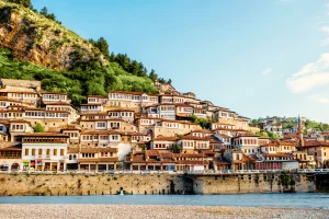 View of Berat's white Ottoman houses stacked on the hillside above the Osum River, Albania